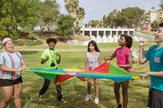 children playing with a parachute
