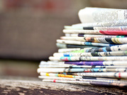 stacked newspapers