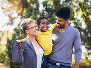 woman and man holding a young boy