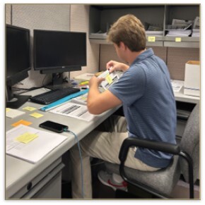 young man working at desk