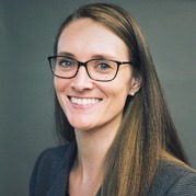 allison's headshot - woman wearing a grey top