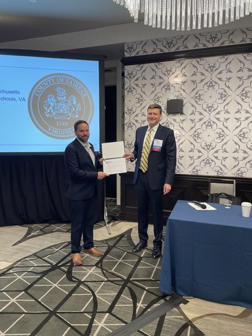 two men holding a certificate