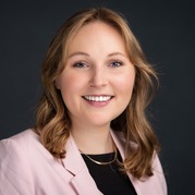 jane's headshot - woman wearing pink blazer
