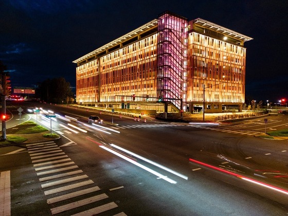 monument drive parking garage at night with cars