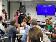people sitting in a meeting room