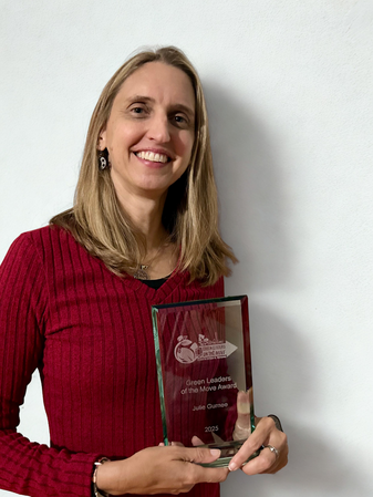 photo of woman holding an award