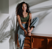 woman looking at the window 