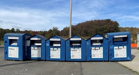 large blue helpsy recycling containers lined up outside