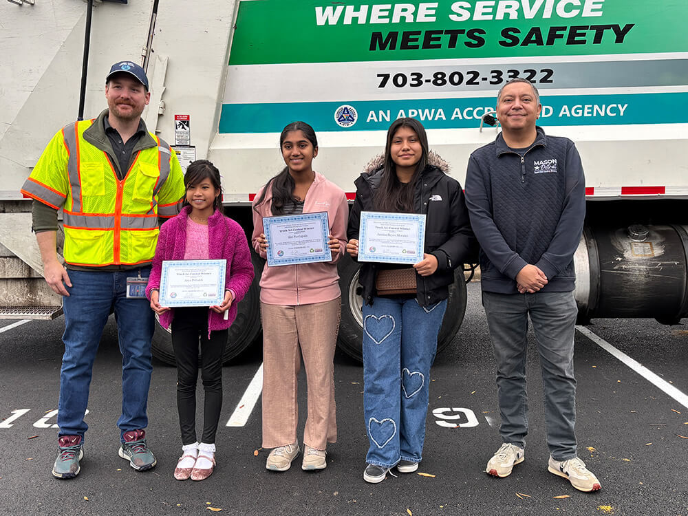 Matt Adams and Supervisor Jimenez with our Trash Truck Art Contest winners: Arya Pribadi, Siri Neelapala, and Jessica Reyes.