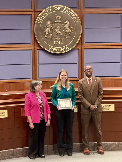 photo of maggie receiving an award