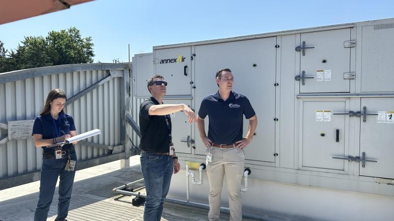 Representatives from an energy services company and OEEC's Kevin Smith performing an energy audit at Bailey's Crossroads Volunteer Fire Department.