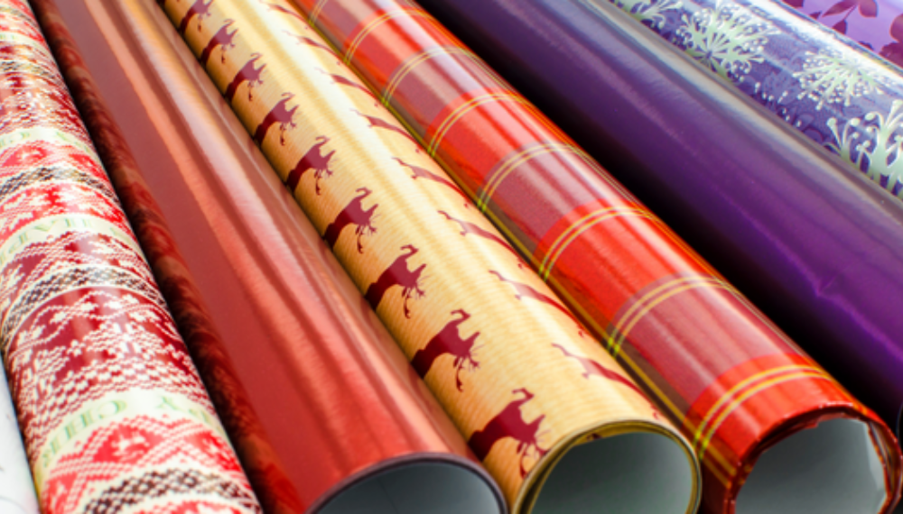 Rolls of wrapping paper with different designs and colors.