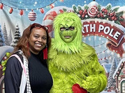 woman posing with Grinch