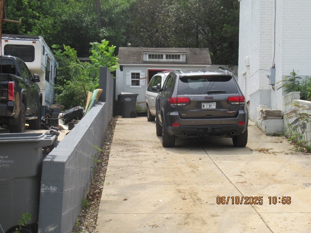 The same residential driveway after debris cleared