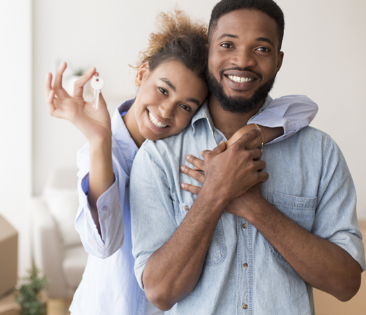 Family with keys to a home