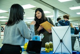 girl checking in conference 