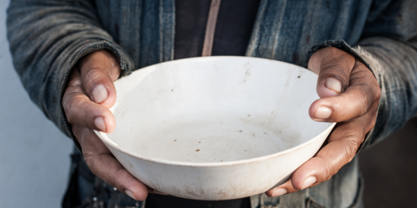 A pair of hands holding an empty bowl.