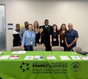 employees standing behind table