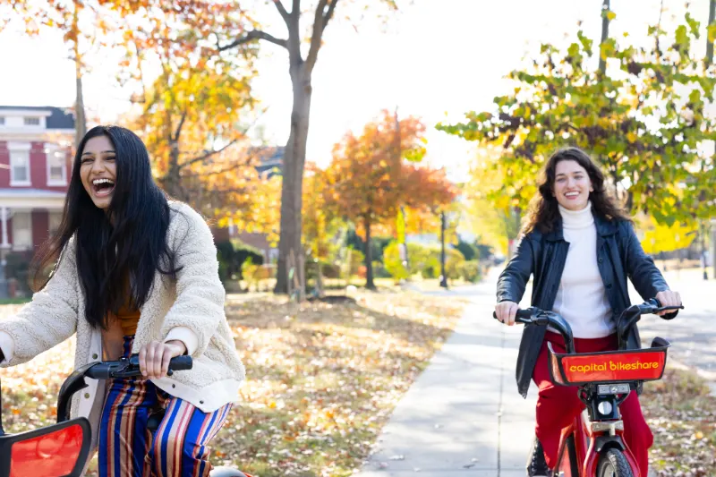 two women riding capital bikes