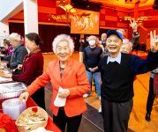 People smile at a previous year's Lunar New Year celebration.