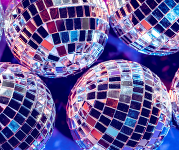 Disco balls reflecting pink and blue.