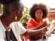 older woman and girl eating