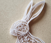 A white paper quilled rabbit. 