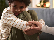 scared child being comforted