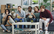 group of people on couch watching movie