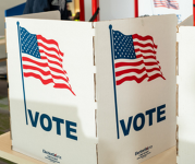 Voting divider with the text "VOTE" and a graphic of an American flag.