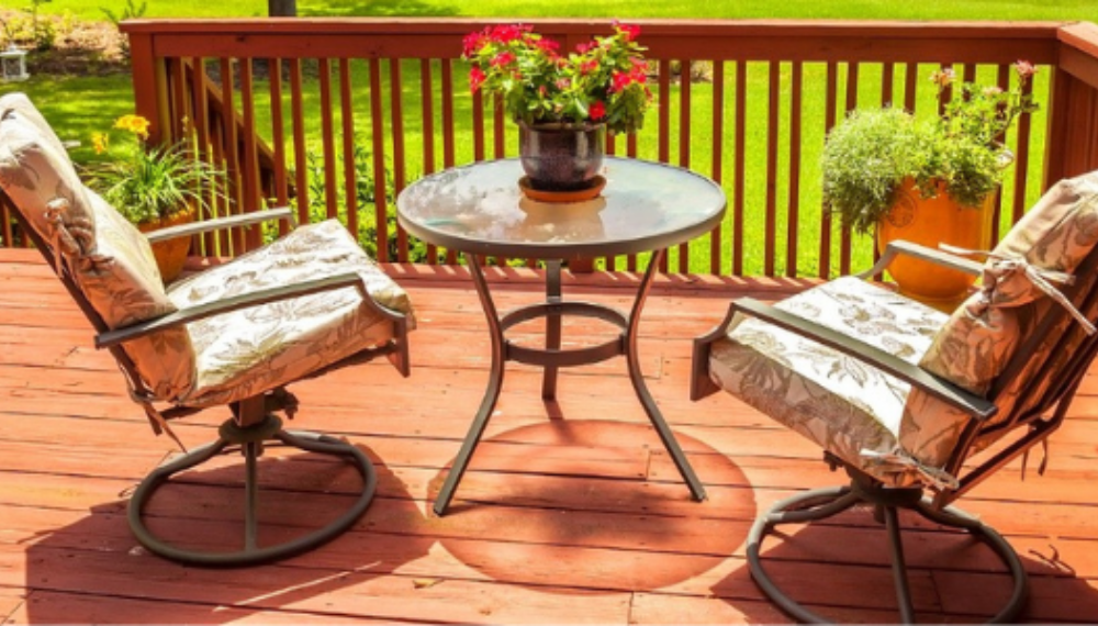 A patio set sits on a finished deck. 