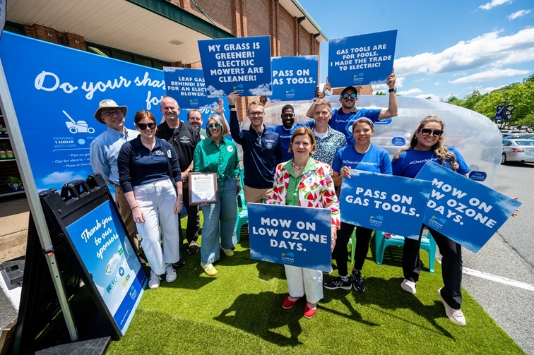 group of people holding signs at event. 