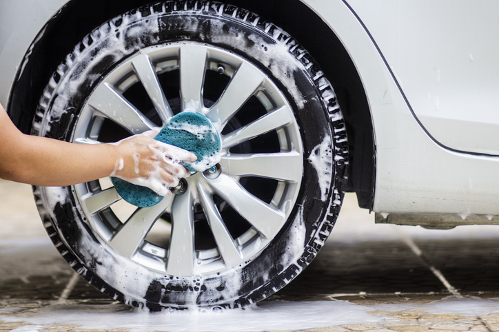 photo of someone washing a car. 