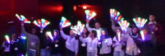 Spark event attendees with glow sticks