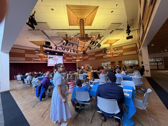 wide angle view of reston community center interior with people at event