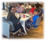 woman and child sitting at table