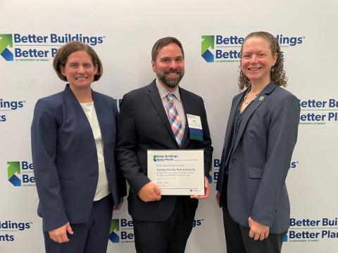Park Authority staff smile while holding the U.S. Department of Energy Better Project Award.