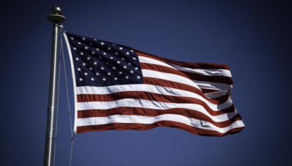 American flag against a blue background. 