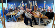 group of men sitting at table
