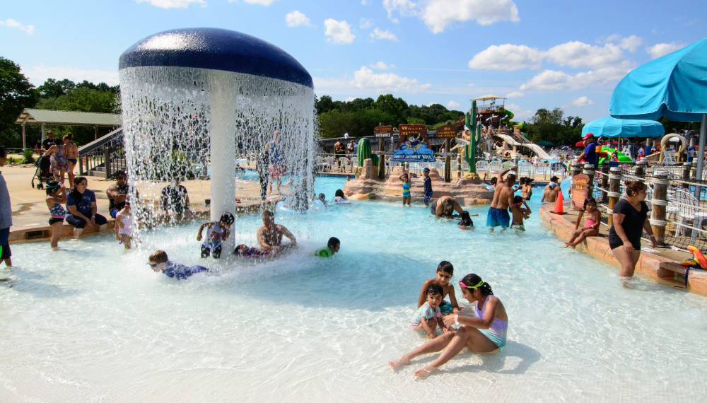 Children play at the The Water Mine Family Swimmin’ Hole.