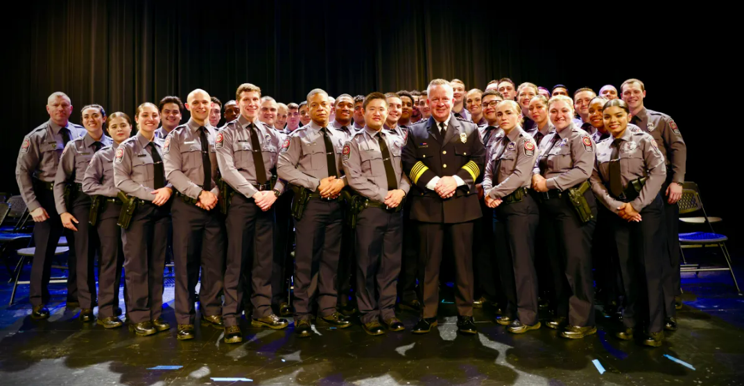 A group photo of the 42 new police officers and 13 deputy sheriffs with Police Chief Kevin Davis in the front. 