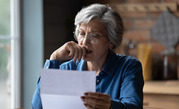 woman looking at a bill