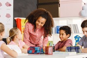 teacher with small students