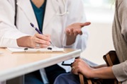 doctor talking with patient