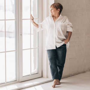 woman standing by the window