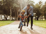 man and child on bike