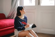 woman looking out the window