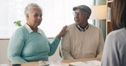 two older adults talking