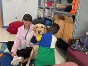 child hugging a dog