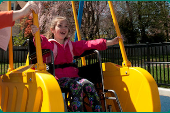 Picture of a white girl in a wheelchair swing